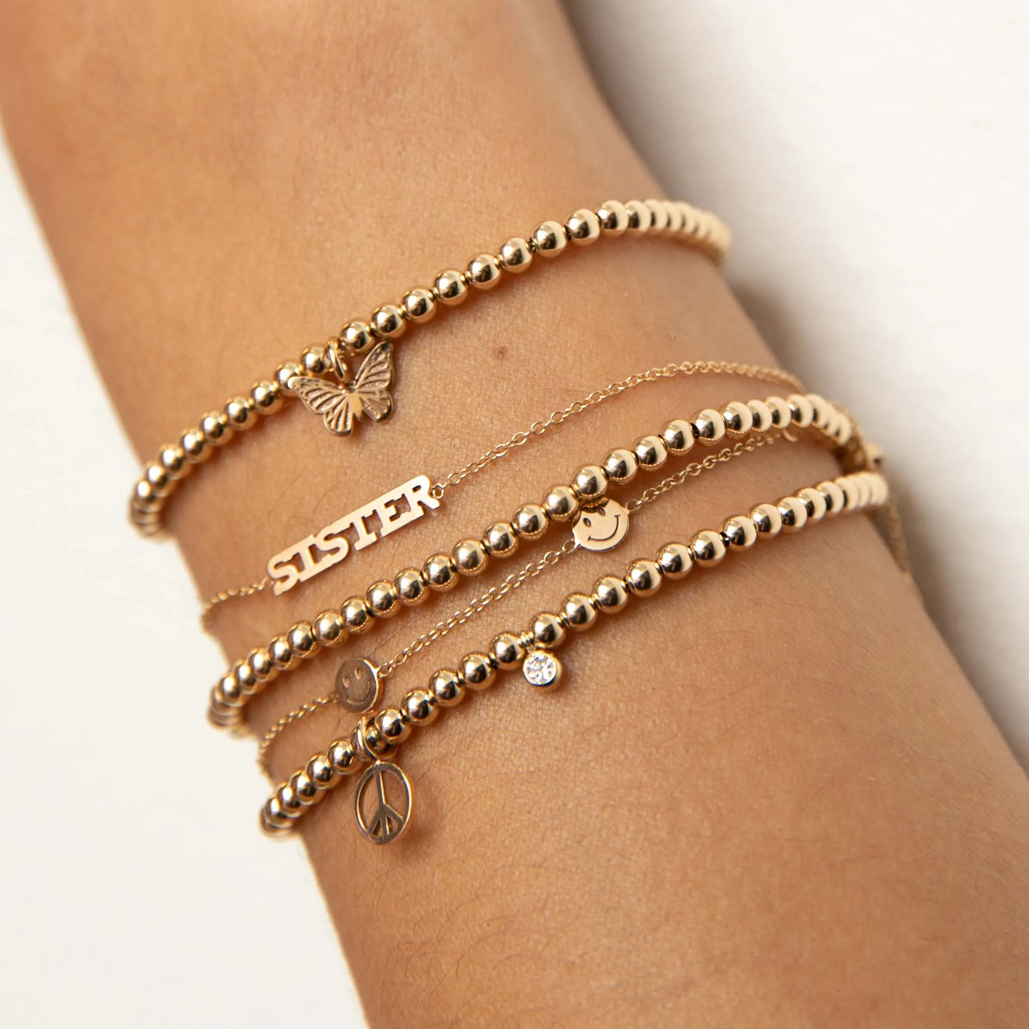 14k 5 Itty Bitty Smiley Face Station Bracelet