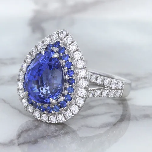 6.08ct Pear Shaped Blue Sapphire Ring with Sapphire and Diamond halo in 18K White Gold