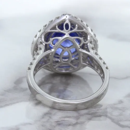 6.08ct Pear Shaped Blue Sapphire Ring with Sapphire and Diamond halo in 18K White Gold