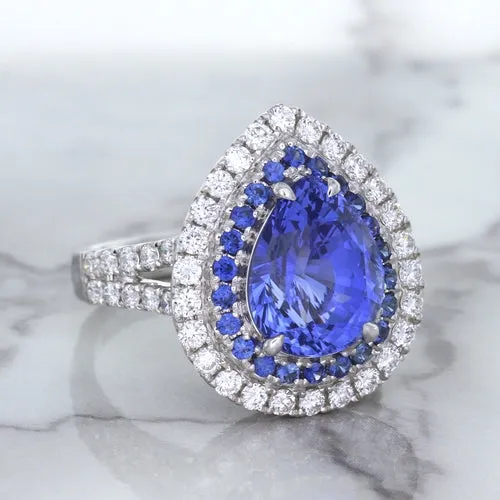 6.08ct Pear Shaped Blue Sapphire Ring with Sapphire and Diamond halo in 18K White Gold