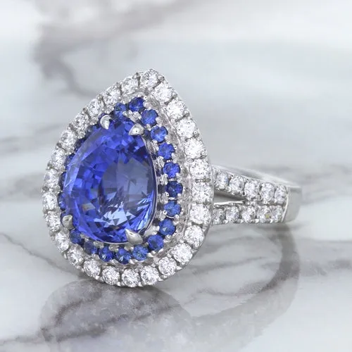 6.08ct Pear Shaped Blue Sapphire Ring with Sapphire and Diamond halo in 18K White Gold
