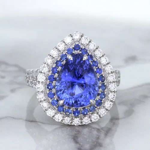 6.08ct Pear Shaped Blue Sapphire Ring with Sapphire and Diamond halo in 18K White Gold