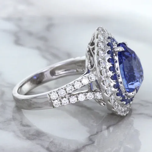 6.08ct Pear Shaped Blue Sapphire Ring with Sapphire and Diamond halo in 18K White Gold