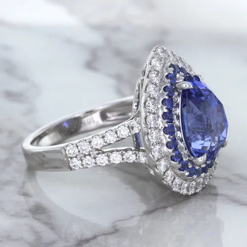 6.08ct Pear Shaped Blue Sapphire Ring with Sapphire and Diamond halo in 18K White Gold