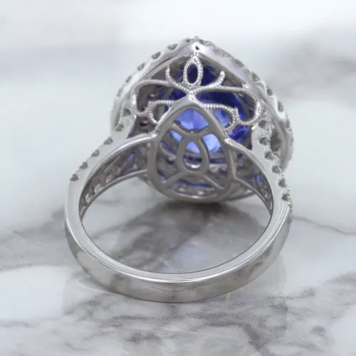 6.08ct Pear Shaped Blue Sapphire Ring with Sapphire and Diamond halo in 18K White Gold