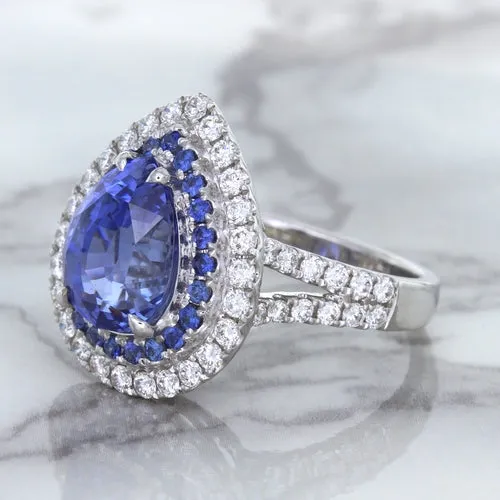 6.08ct Pear Shaped Blue Sapphire Ring with Sapphire and Diamond halo in 18K White Gold