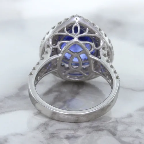 6.08ct Pear Shaped Blue Sapphire Ring with Sapphire and Diamond halo in 18K White Gold