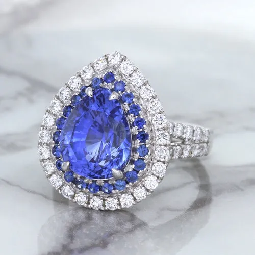 6.08ct Pear Shaped Blue Sapphire Ring with Sapphire and Diamond halo in 18K White Gold
