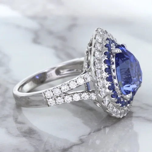 6.08ct Pear Shaped Blue Sapphire Ring with Sapphire and Diamond halo in 18K White Gold