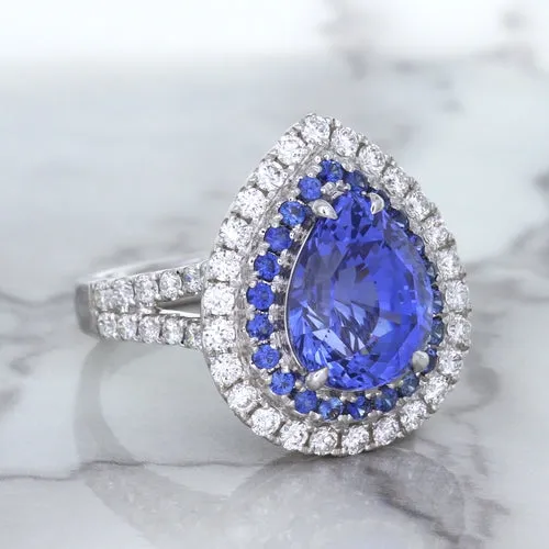 6.08ct Pear Shaped Blue Sapphire Ring with Sapphire and Diamond halo in 18K White Gold