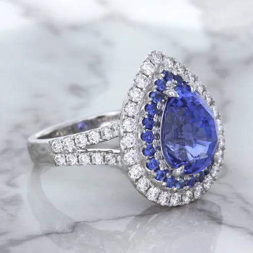 6.08ct Pear Shaped Blue Sapphire Ring with Sapphire and Diamond halo in 18K White Gold