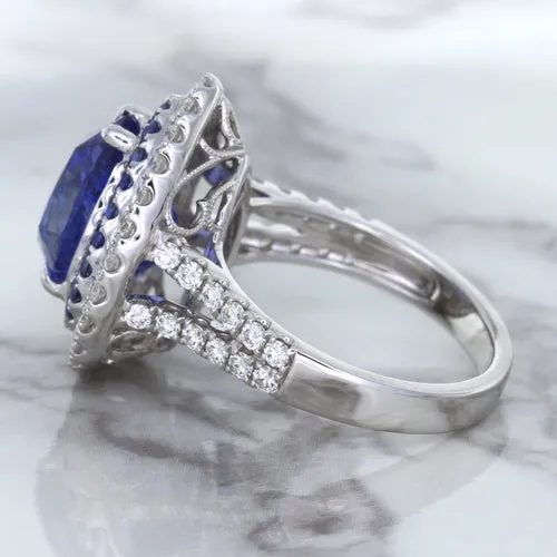 6.08ct Pear Shaped Blue Sapphire Ring with Sapphire and Diamond halo in 18K White Gold