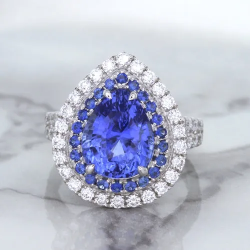 6.08ct Pear Shaped Blue Sapphire Ring with Sapphire and Diamond halo in 18K White Gold