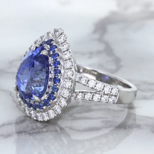 6.08ct Pear Shaped Blue Sapphire Ring with Sapphire and Diamond halo in 18K White Gold