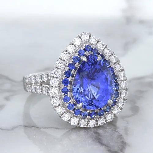 6.08ct Pear Shaped Blue Sapphire Ring with Sapphire and Diamond halo in 18K White Gold