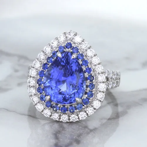 6.08ct Pear Shaped Blue Sapphire Ring with Sapphire and Diamond halo in 18K White Gold