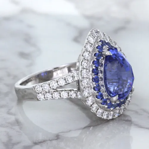 6.08ct Pear Shaped Blue Sapphire Ring with Sapphire and Diamond halo in 18K White Gold