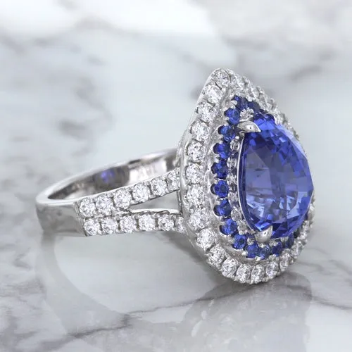 6.08ct Pear Shaped Blue Sapphire Ring with Sapphire and Diamond halo in 18K White Gold