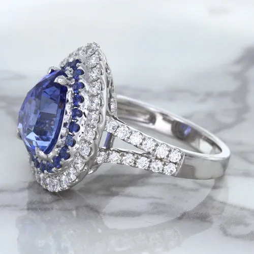 6.08ct Pear Shaped Blue Sapphire Ring with Sapphire and Diamond halo in 18K White Gold
