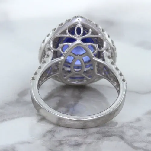 6.08ct Pear Shaped Blue Sapphire Ring with Sapphire and Diamond halo in 18K White Gold