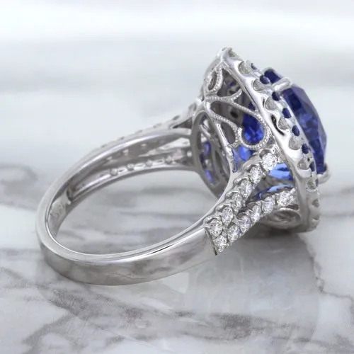 6.08ct Pear Shaped Blue Sapphire Ring with Sapphire and Diamond halo in 18K White Gold