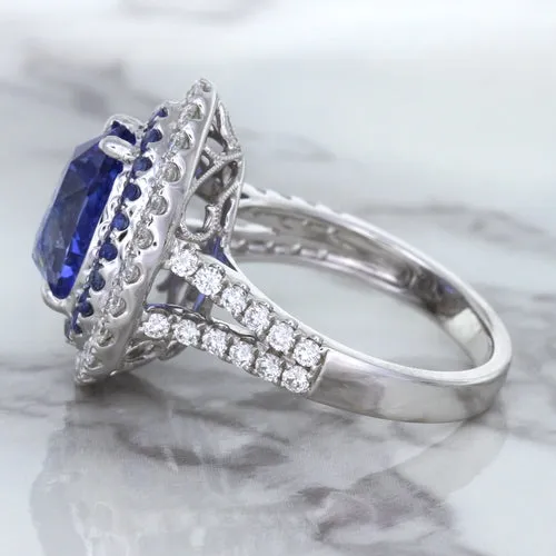 6.08ct Pear Shaped Blue Sapphire Ring with Sapphire and Diamond halo in 18K White Gold