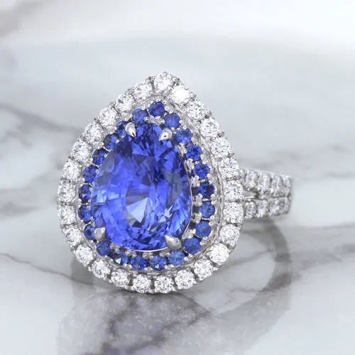 6.08ct Pear Shaped Blue Sapphire Ring with Sapphire and Diamond halo in 18K White Gold
