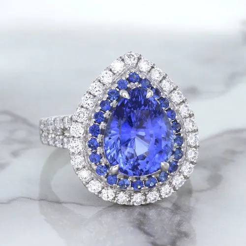 6.08ct Pear Shaped Blue Sapphire Ring with Sapphire and Diamond halo in 18K White Gold