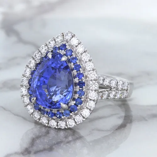 6.08ct Pear Shaped Blue Sapphire Ring with Sapphire and Diamond halo in 18K White Gold