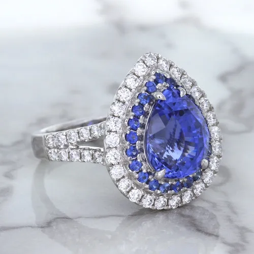6.08ct Pear Shaped Blue Sapphire Ring with Sapphire and Diamond halo in 18K White Gold