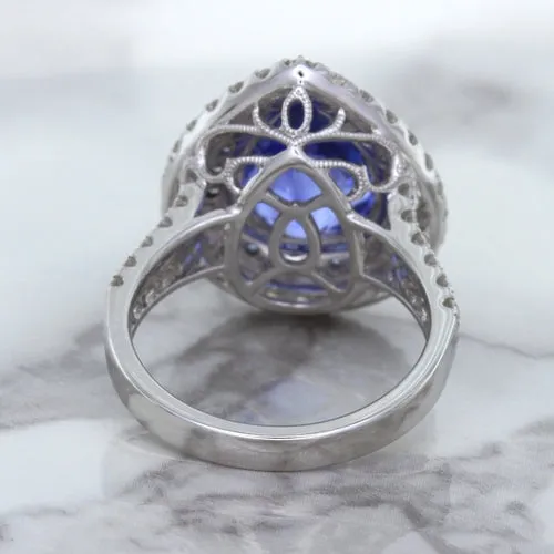 6.08ct Pear Shaped Blue Sapphire Ring with Sapphire and Diamond halo in 18K White Gold