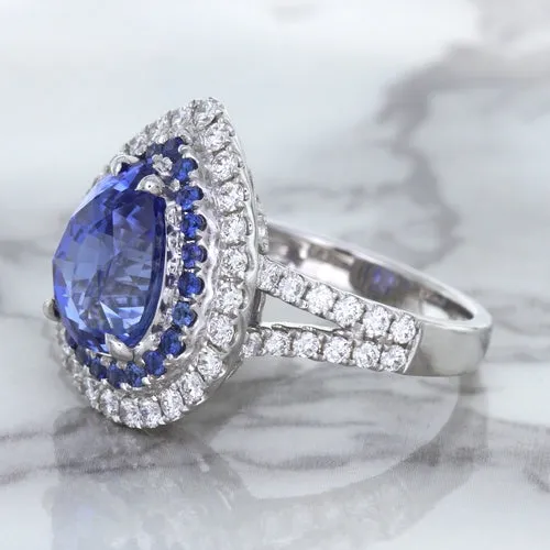 6.08ct Pear Shaped Blue Sapphire Ring with Sapphire and Diamond halo in 18K White Gold