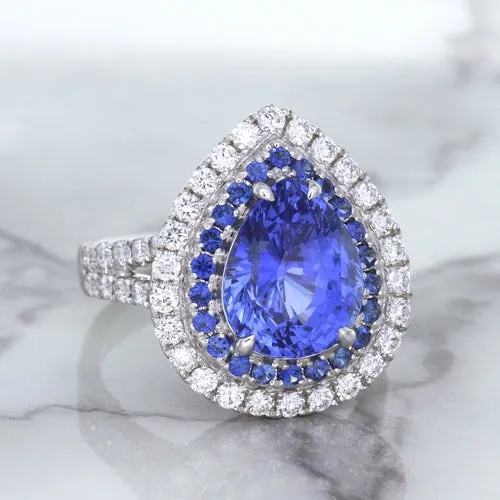 6.08ct Pear Shaped Blue Sapphire Ring with Sapphire and Diamond halo in 18K White Gold