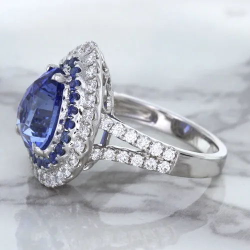 6.08ct Pear Shaped Blue Sapphire Ring with Sapphire and Diamond halo in 18K White Gold