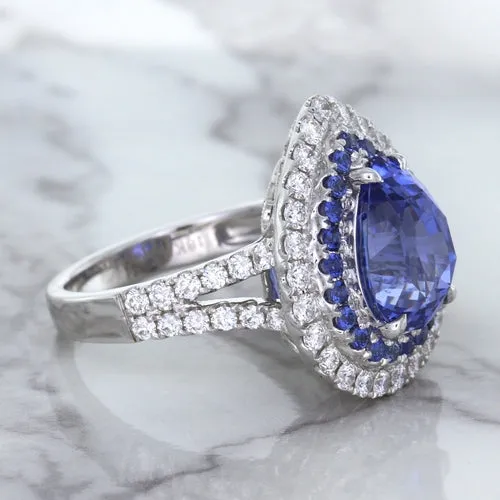 6.08ct Pear Shaped Blue Sapphire Ring with Sapphire and Diamond halo in 18K White Gold