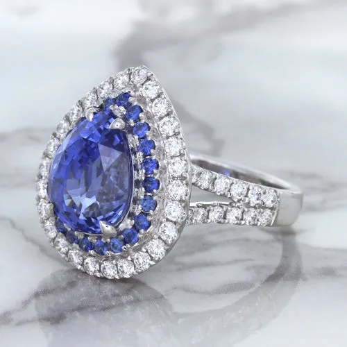 6.08ct Pear Shaped Blue Sapphire Ring with Sapphire and Diamond halo in 18K White Gold