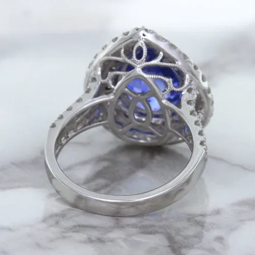 6.08ct Pear Shaped Blue Sapphire Ring with Sapphire and Diamond halo in 18K White Gold