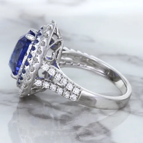 6.08ct Pear Shaped Blue Sapphire Ring with Sapphire and Diamond halo in 18K White Gold