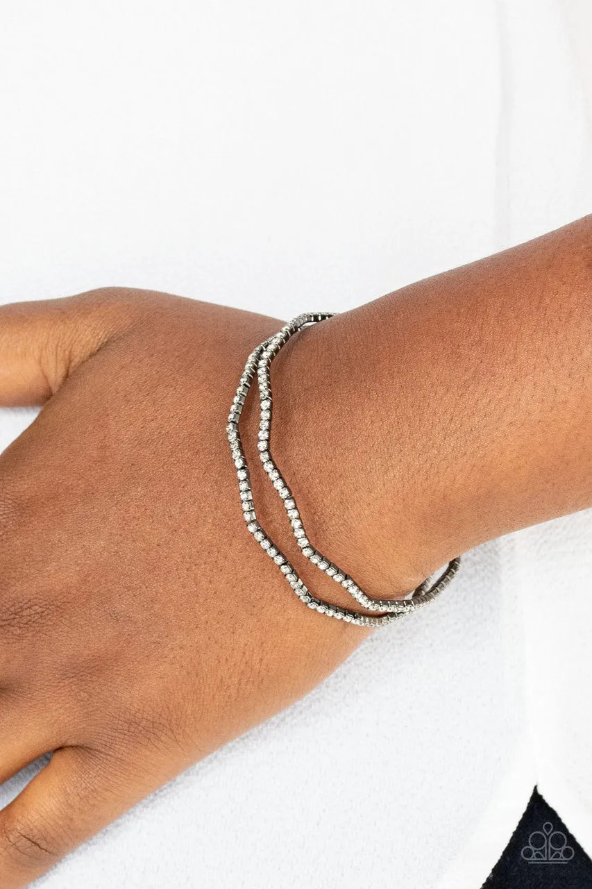 Delicate Dazzle - Black - White Rhinestone Gunmetal Paparazzi Flex Cuff Bracelet