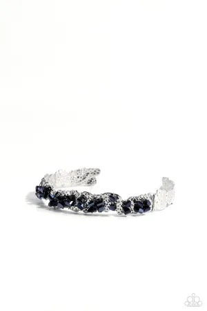 Enticingly Icy - Blue - Metallic Gem Hammered Asymmetrical Paparazzi Cuff Bracelet