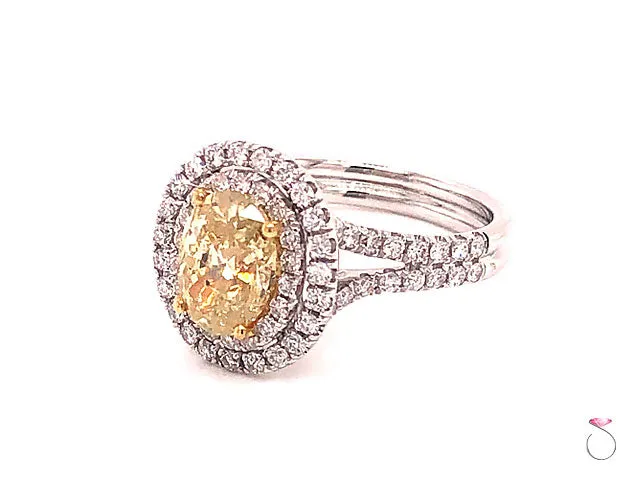 Natural Fancy Yellow Oval Diamond Halo Ring, 18K White Gold 2.34 CTW