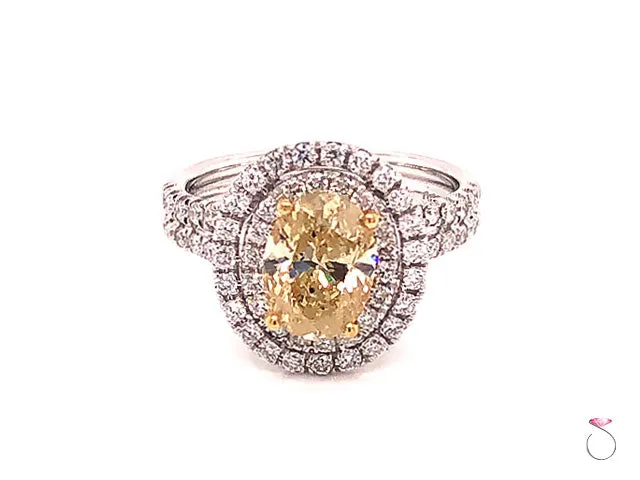 Natural Fancy Yellow Oval Diamond Halo Ring, 18K White Gold 2.34 CTW