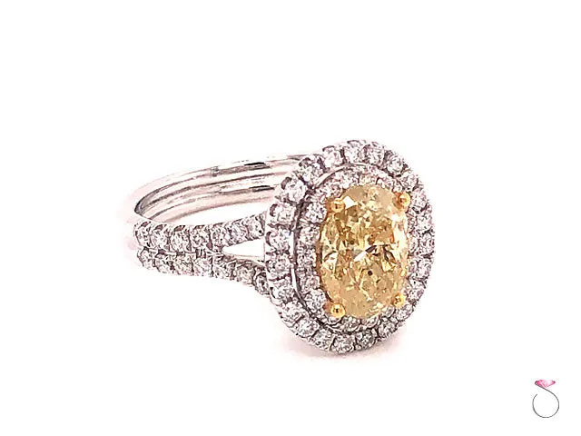 Natural Fancy Yellow Oval Diamond Halo Ring, 18K White Gold 2.34 CTW