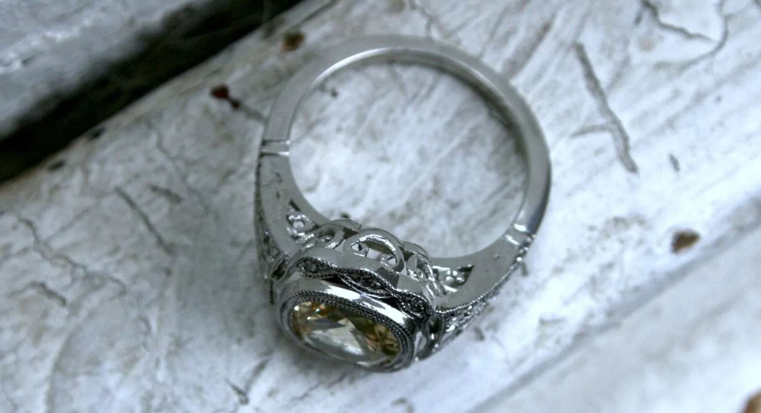 Natural Yellow Sapphire and Diamond Halo Engagement Ring in Platinum.