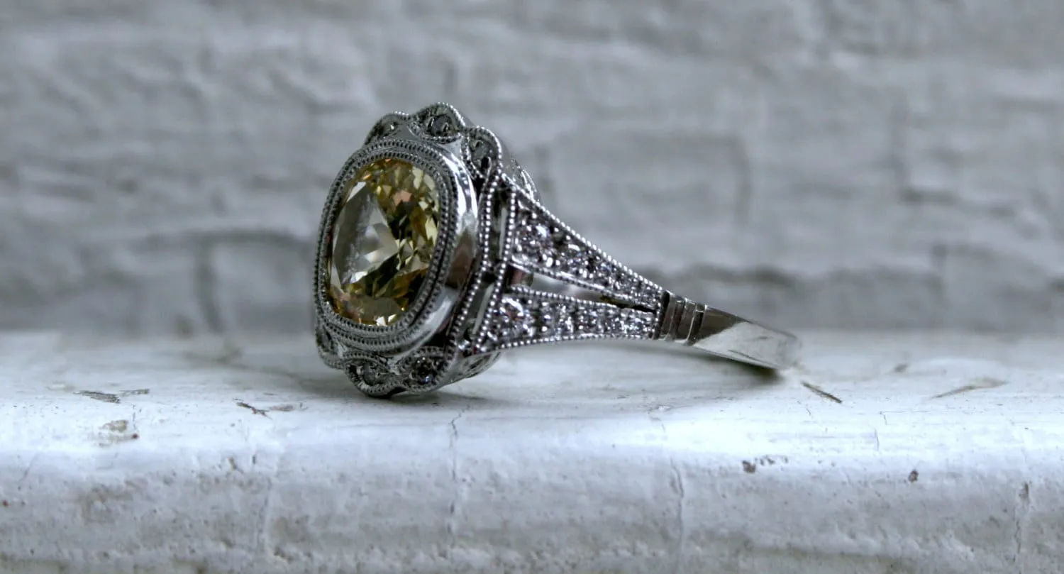 Natural Yellow Sapphire and Diamond Halo Engagement Ring in Platinum.