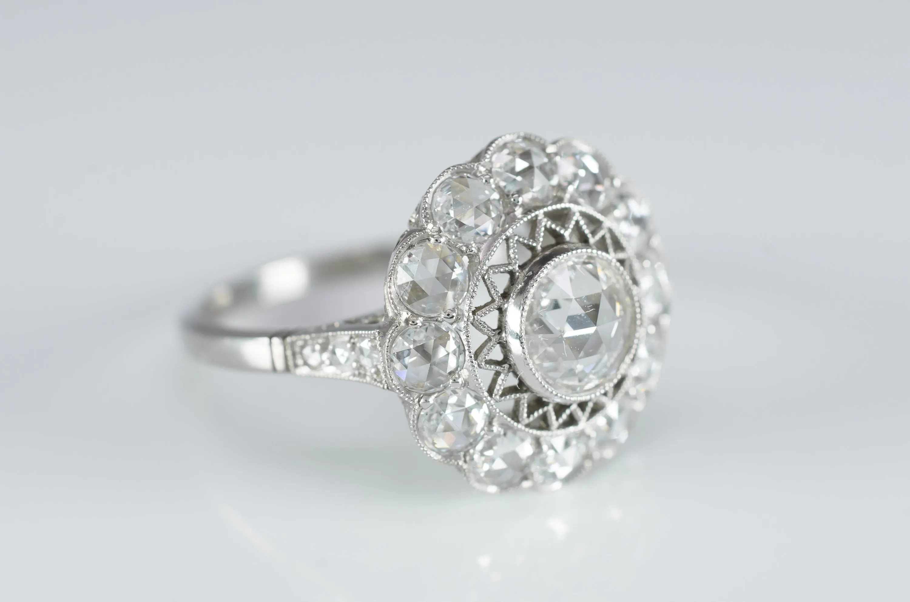 ROSE CUT DIAMOND HALO RING IN PLATINUM
