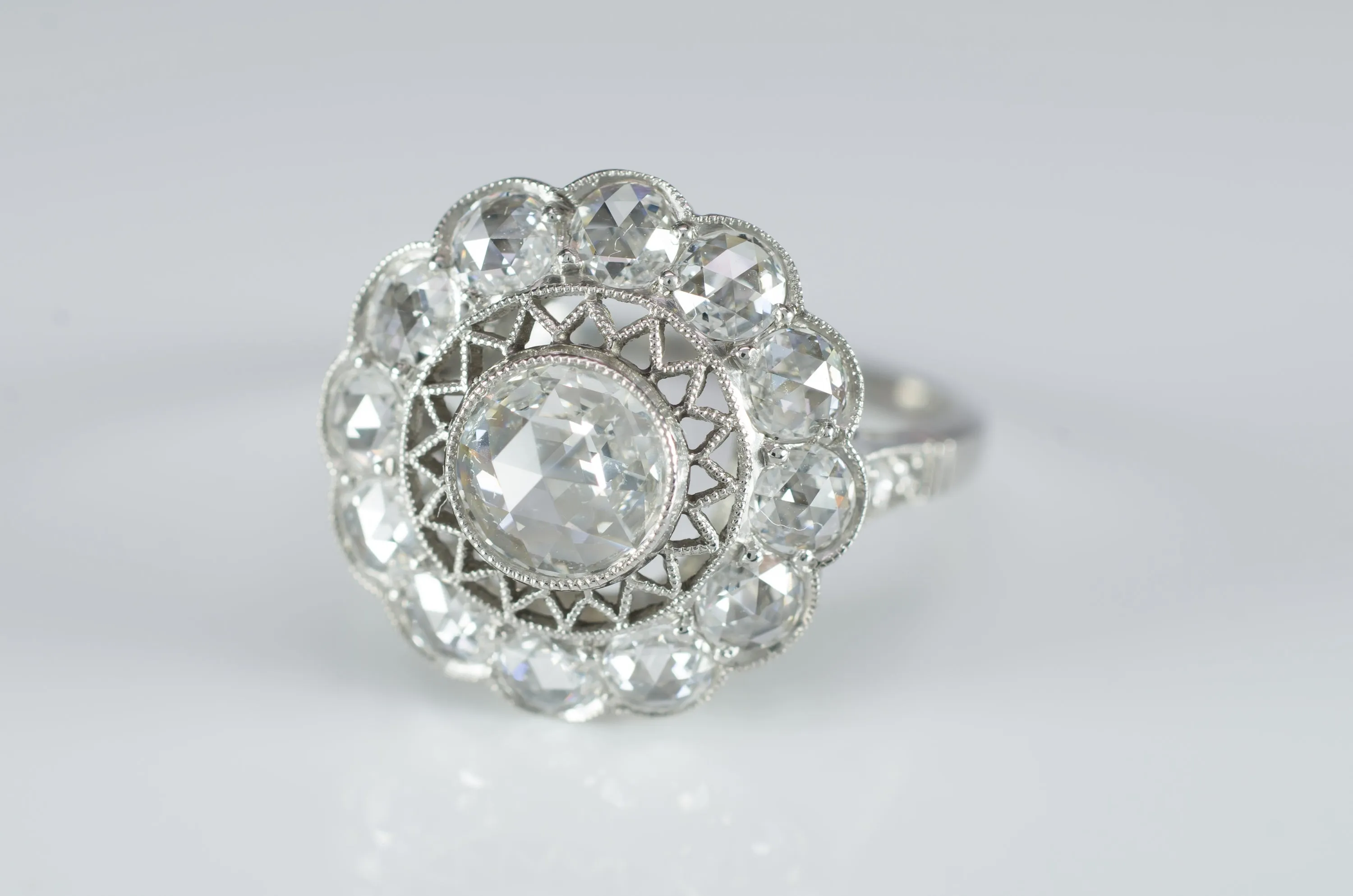 ROSE CUT DIAMOND HALO RING IN PLATINUM