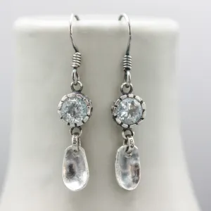 Round blue topaz earrings in silver bezel setting with silver leaf on sterling silver hooks style